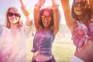 Girls covered in paint at a special event or festival