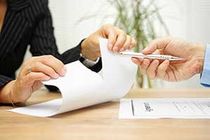 Insurance broker reviewing EPLI policies with business owner to protect against claims and lawsuits