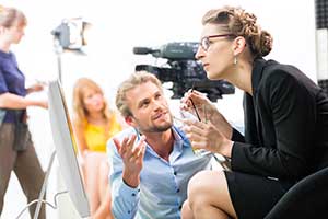 Production crew on film production set protected by film production insurance