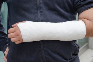 worker in a cast whose employer purchased workers compensation insurance
