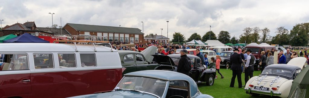 a crowd of spectators attending a car show that is covered by special event insurance to protect against injury and damages or other misfortunes