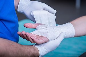 actor gets treatment for hand after being injured on set but the production crew had on set liability insurance so they do not have to pay for treatment