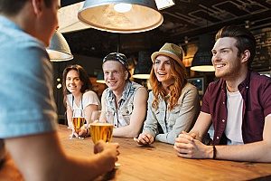 an entertainment insurance broker going to a bar with a group of work friends to a bar that he offers services for