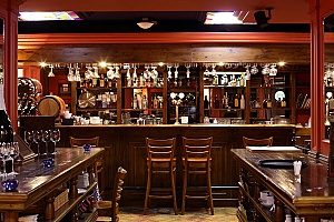 a picture of a bar within a restaurant that msut be covered by a strong liquor liability insurance policy since they regularly have guests coming in that argue