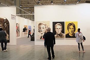 paintings of famous people at an art exhibit that contacted entertainment insurance brokers to cover their prestigious paintings in case something were to happen to them