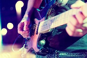 a guitarist in a band that has acquired insurance for bands