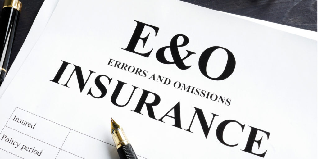 A stack of papers with E&O Insurance written on it
