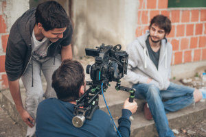 a film crew shooting in an outdoor location for a short term film production that is covered by insurance