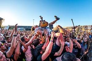 singer surfing the crowd that is a potential liability without concert insurance