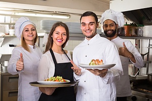 happy restaurant workers because of special event insurance