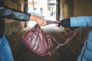 woman being robbed after leaving a restaurant