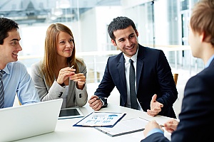 a business insurance broker meeting with a business owner