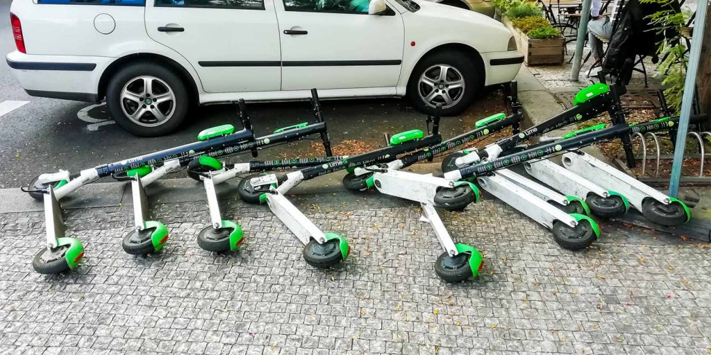 electric scooters lined up representing micromobility