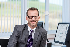 Insurance agent sitting at desk 
