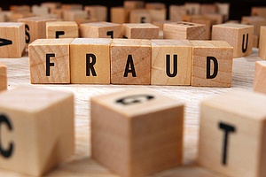 building blocks spelling out the word "fraud"