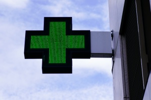 cannabis dispensaries with their green plus medical sign on