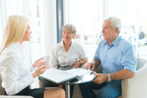 older couple learning the benefits of whole life insurance