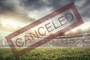 mass event cancelled red stamp with soccer background