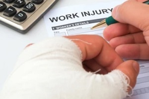 worker filling injury claim form in with the business Oklahoma cannabis insurance policy 