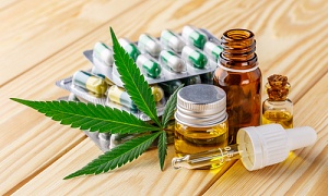 cannabis oils, serums and other products on display on a table