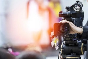 man with rolling camera