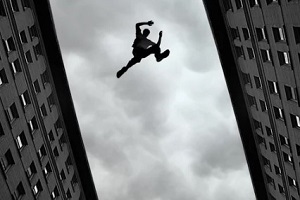 stuntman jumping across the buildings