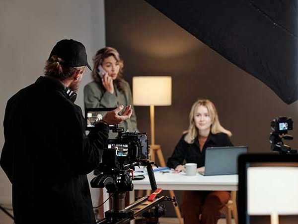 Director talking to woman on set of a commercial production