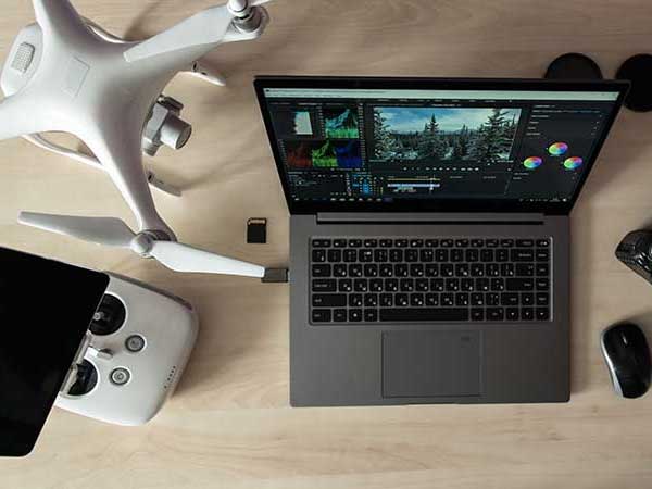 Film production drone next to laptop