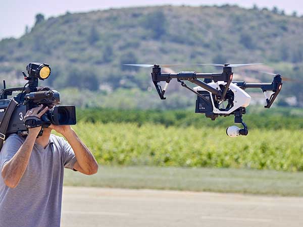 Flying filming drone covered by drone insurance