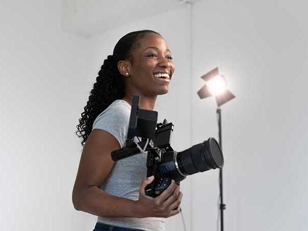 Professional videographer enjoying her job