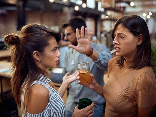Women arguing at a restaurant