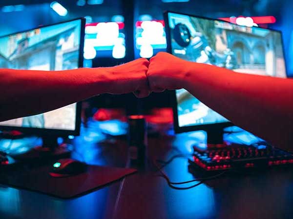 eSports gamers bumping fists after win