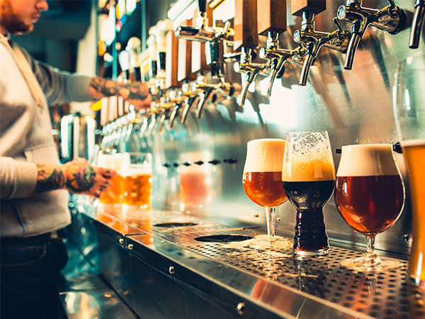 glasses of beer filled for bar customers