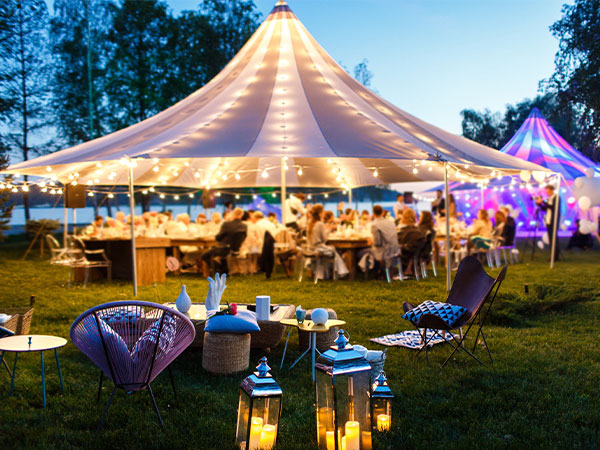 outdoor event with lights and tents