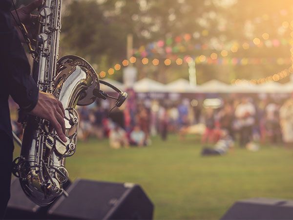 saxophone player at an outdoor festival