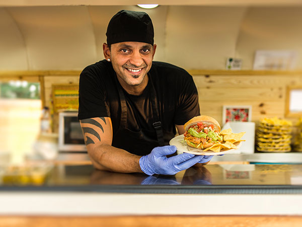 small vendor owner serving plate