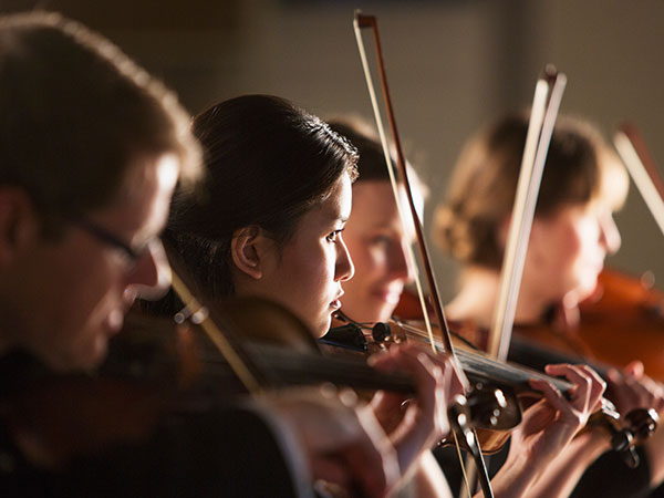 violinists performing on stage