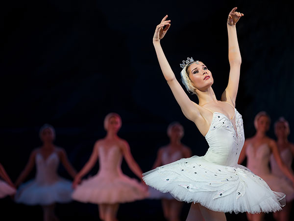 white swan ballerina performing on stage