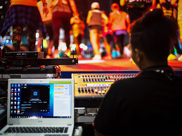 women on the sound check booth at an event