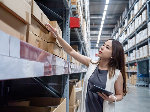 Business owner checking on products