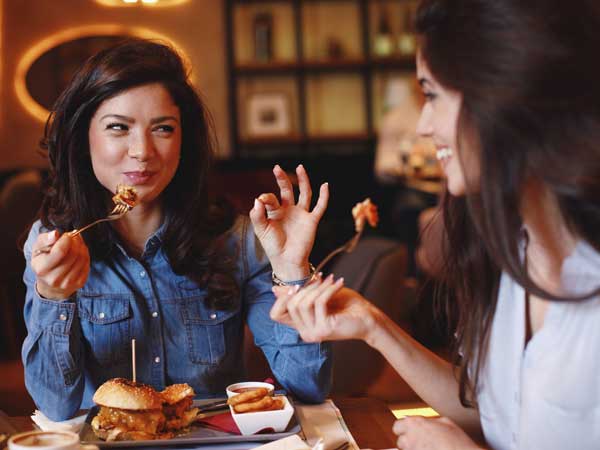 Friends eating dinner at a restaurant