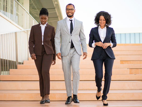 Three attorneys walking down steps