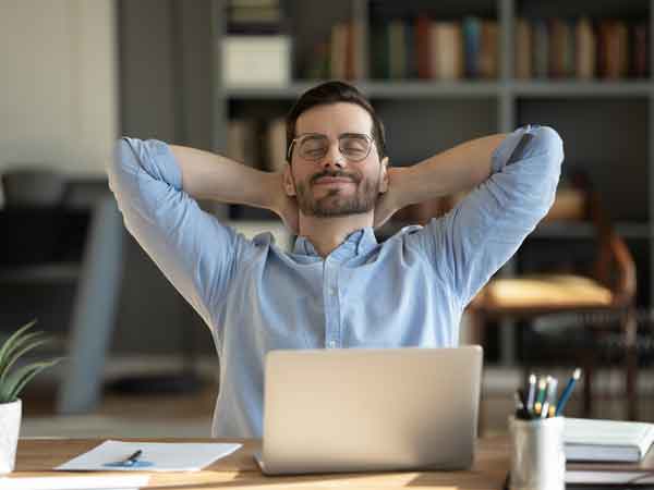 Business owner relaxing at his desk