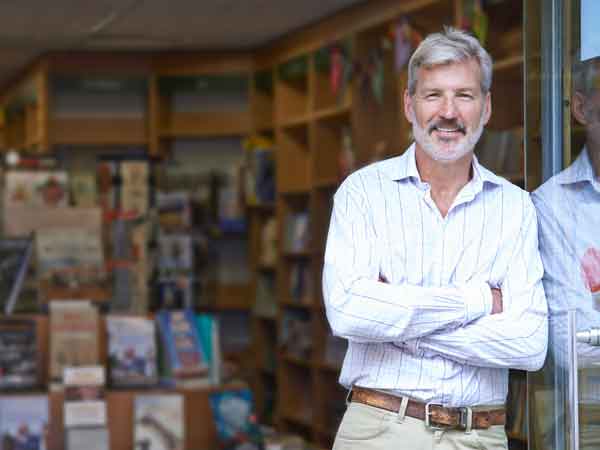 Business owner standing in doorway