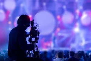 man recording live event