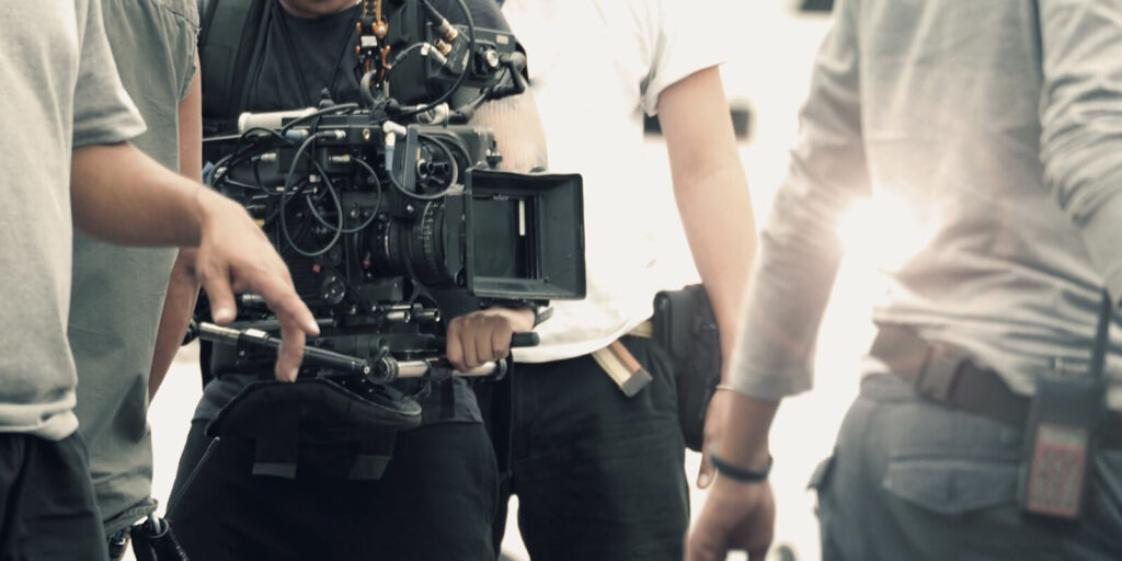 blurred images of high definition video camera and lens on steady equipment support such as gimbal steady