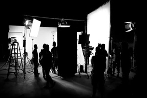 Silhouette images of video production behind the scenes or b-roll or making of TV commercial movie that film crew team lightman and cameraman working together