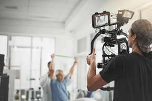 videographer and recording with camera for online vlog, filmmaking or documentary at studio