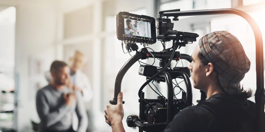 shooting and man with camera in recording for healthcare