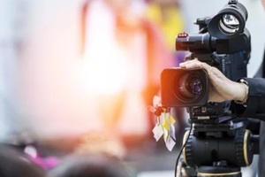 video camera operator working with his equipment